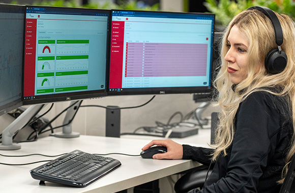 A Trojan service technician troubleshooting over the phone with a customer